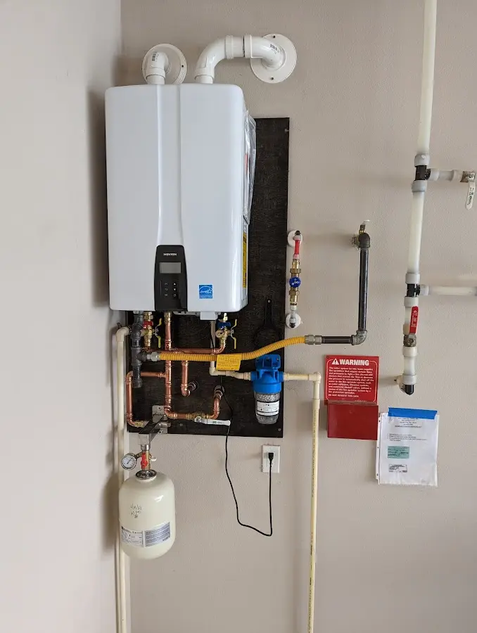 Professional plumber installing copper piping in a Missoula home